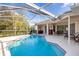 Screened pool with a patio and seating at 21312 Preservation Dr, Land O Lakes, FL 34638