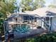 Aerial view of home with pool and screened enclosure at 1592 Eagles Reach, Tarpon Springs, FL 34688