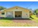 Screened-in porch with seating area attached to a detached garage at 19351 Yontz Rd, Brooksville, FL 34601