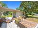 Inviting patio with wooden furniture and a view of the backyard at 19351 Yontz Rd, Brooksville, FL 34601