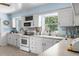 White kitchen with light blue walls and stainless steel appliances at 19351 Yontz Rd, Brooksville, FL 34601