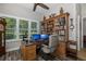 Home office with built-in bookcases and granite desk at 1453 El Pardo Dr, Trinity, FL 34655