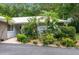 Landscaped front yard with paved walkway at 2170 Bow Ln, Safety Harbor, FL 34695