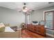 Bedroom with hardwood floors, ceiling fan, and built-in dresser at 3154 Brigantine Ct, New Port Richey, FL 34652