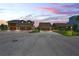Two houses at dusk with three-car garages at 3154 Brigantine Ct, New Port Richey, FL 34652