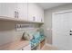 Laundry room with bench seating and ample storage at 3154 Brigantine Ct, New Port Richey, FL 34652
