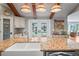 Open kitchen with granite island, stainless steel appliances, and water views at 3154 Brigantine Ct, New Port Richey, FL 34652