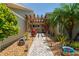 Brick pathway leads to a pergola-covered entrance at 3154 Brigantine Ct, New Port Richey, FL 34652