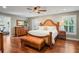 Spacious main bedroom with a king-size bed and wood furniture at 3154 Brigantine Ct, New Port Richey, FL 34652