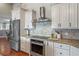 Modern kitchen featuring stainless steel appliances and granite countertops at 3154 Brigantine Ct, New Port Richey, FL 34652