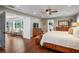 Bright main bedroom with king-size bed and access to private sitting area at 3154 Brigantine Ct, New Port Richey, FL 34652