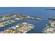 Aerial view of waterfront community with houses and boats at 3154 Brigantine Ct, New Port Richey, FL 34652
