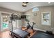 Home gym with a treadmill, exercise bike, and access to a pool at 3154 Brigantine Ct, New Port Richey, FL 34652