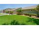Landscaped front yard with lush grass and mature plants at 3154 Brigantine Ct, New Port Richey, FL 34652
