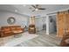 Open living space with leather seating and barn doors at 3154 Brigantine Ct, New Port Richey, FL 34652
