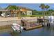 Private boat dock with covered area and steps leading to the water at 3154 Brigantine Ct, New Port Richey, FL 34652