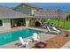 Relax by the pool with firepit and tiki hut at 3154 Brigantine Ct, New Port Richey, FL 34652