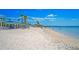 Relaxing beach with white sand and ample seating at 3154 Brigantine Ct, New Port Richey, FL 34652