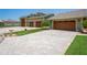 Spacious driveway with brick pavers and three-car garage at 3154 Brigantine Ct, New Port Richey, FL 34652