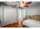 Bedroom with hardwood floors, double doors, and daybed at 3154 Brigantine Ct, New Port Richey, FL 34652