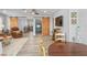 Spacious living room featuring a leather couch and barn doors at 3154 Brigantine Ct, New Port Richey, FL 34652