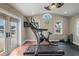 Home gym with a treadmill, exercise bike, and pool view at 3154 Brigantine Ct, New Port Richey, FL 34652