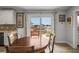 Bright dining area with wooden table and chairs, offering water views at 3154 Brigantine Ct, New Port Richey, FL 34652