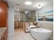 Luxurious bathroom with a free-standing tub and a separate shower at 3154 Brigantine Ct, New Port Richey, FL 34652