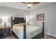 Cozy bedroom featuring a post bed, nightstands, and ceiling fan at 3154 Brigantine Ct, New Port Richey, FL 34652