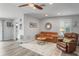 Cozy living room with leather seating and a large mirror at 3154 Brigantine Ct, New Port Richey, FL 34652