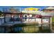 Multi-level waterfront deck with seating area and private boat dock at 4040 Hermosa Blvd, Hernando Beach, FL 34607