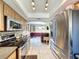 Kitchen features stainless steel appliances and view to living room at 4040 Hermosa Blvd, Hernando Beach, FL 34607