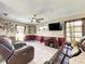 Living room with leather couches and large TV at 4040 Hermosa Blvd, Hernando Beach, FL 34607