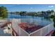 Elevated deck with table and chairs, perfect for enjoying water views at 4040 Hermosa Blvd, Hernando Beach, FL 34607