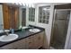 Double vanity bathroom with a walk-in shower and a modern design at 2077 Wetland Pt # 1202, Lutz, FL 33558