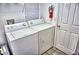 Convenient laundry room with a washer and dryer at 2077 Wetland Pt # 1202, Lutz, FL 33558