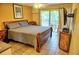 Comfortable bedroom with a queen-size bed and access to a balcony at 2077 Wetland Pt # 1202, Lutz, FL 33558