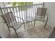 Private balcony with two chairs and a small table, perfect for relaxing at 2077 Wetland Pt # 1202, Lutz, FL 33558
