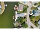 Aerial view of a waterfront property with boat docks, showcasing the coastal community and surrounding waterways at 6629 Harbor Dr, Hudson, FL 34667