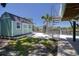 Exterior with a view of a green accessory dwelling and a waterfront view of the canal at 6629 Harbor Dr, Hudson, FL 34667