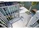 View of the home from the exterior staircase, a green structure, and lush landscaping on the waterfront at 6629 Harbor Dr, Hudson, FL 34667