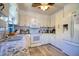 Bright kitchen with white cabinetry, a tiled backsplash, and stainless steel appliances at 6629 Harbor Dr, Hudson, FL 34667
