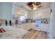 Well-lit kitchen with white cabinets, granite countertops, stainless steel appliances, and tiled backsplash at 6629 Harbor Dr, Hudson, FL 34667