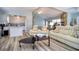 Spacious living room featuring an open floor plan, a stone fireplace, and access to the kitchen at 6629 Harbor Dr, Hudson, FL 34667