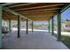 Under-house space featuring covered patio area with views of the waterfront and community at 6629 Harbor Dr, Hudson, FL 34667