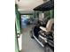 Covered under-house area showcasing a golf cart and outdoor seating, perfect for relaxing by the water at 6629 Harbor Dr, Hudson, FL 34667