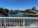 Picturesque waterfront view from the deck, featuring lush greenery and tranquil waters, offering serenity and natural beauty at 6629 Harbor Dr, Hudson, FL 34667