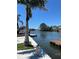 Gorgeous waterfront view from the property, featuring a serene canal and a private dock for boating and relaxation at 6629 Harbor Dr, Hudson, FL 34667