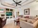 Relaxing living room with a large sectional sofa and built-in entertainment center at 5378 Legend Hills Ln, Spring Hill, FL 34609