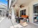 Relaxing covered patio with seating area and fire pit, perfect for outdoor entertaining at 5378 Legend Hills Ln, Spring Hill, FL 34609